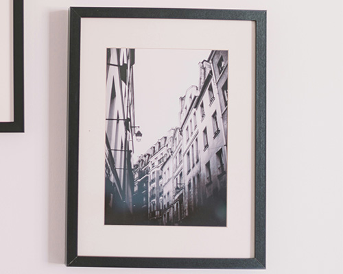 Photo of buildings in a frame.