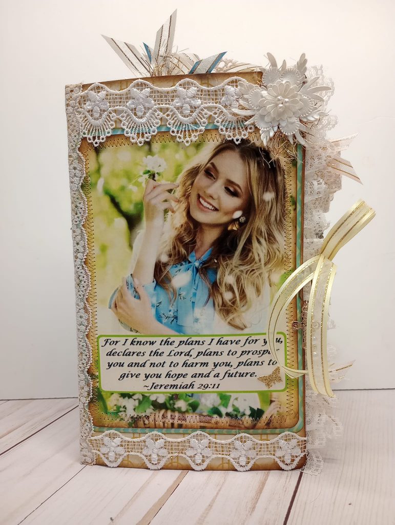 Elegant memory book cover with an Image of a woman with a flower.