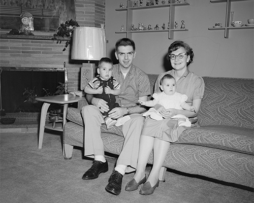 Photo of a couple and their two little children.